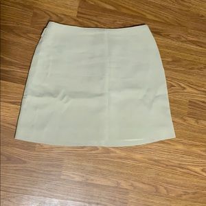 Tan ribbed mini skirt with belt loops by Bebe